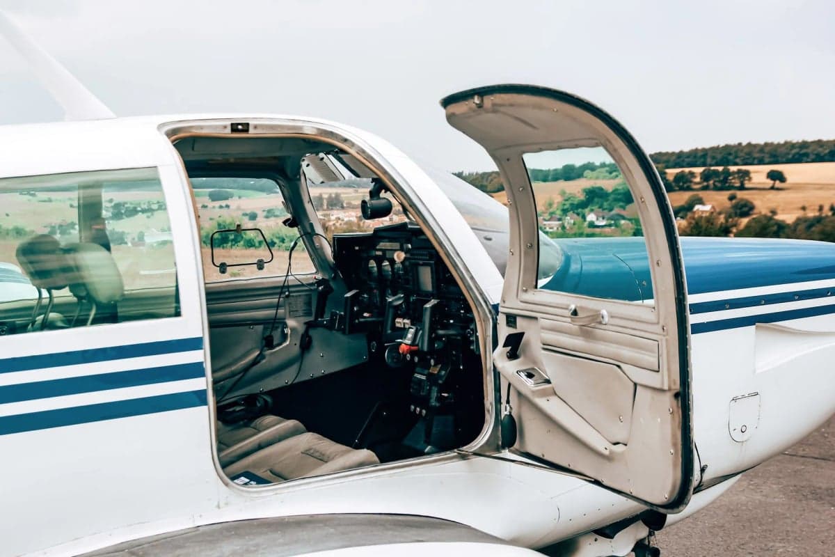 N310FW parked on a runway with trees in the background.