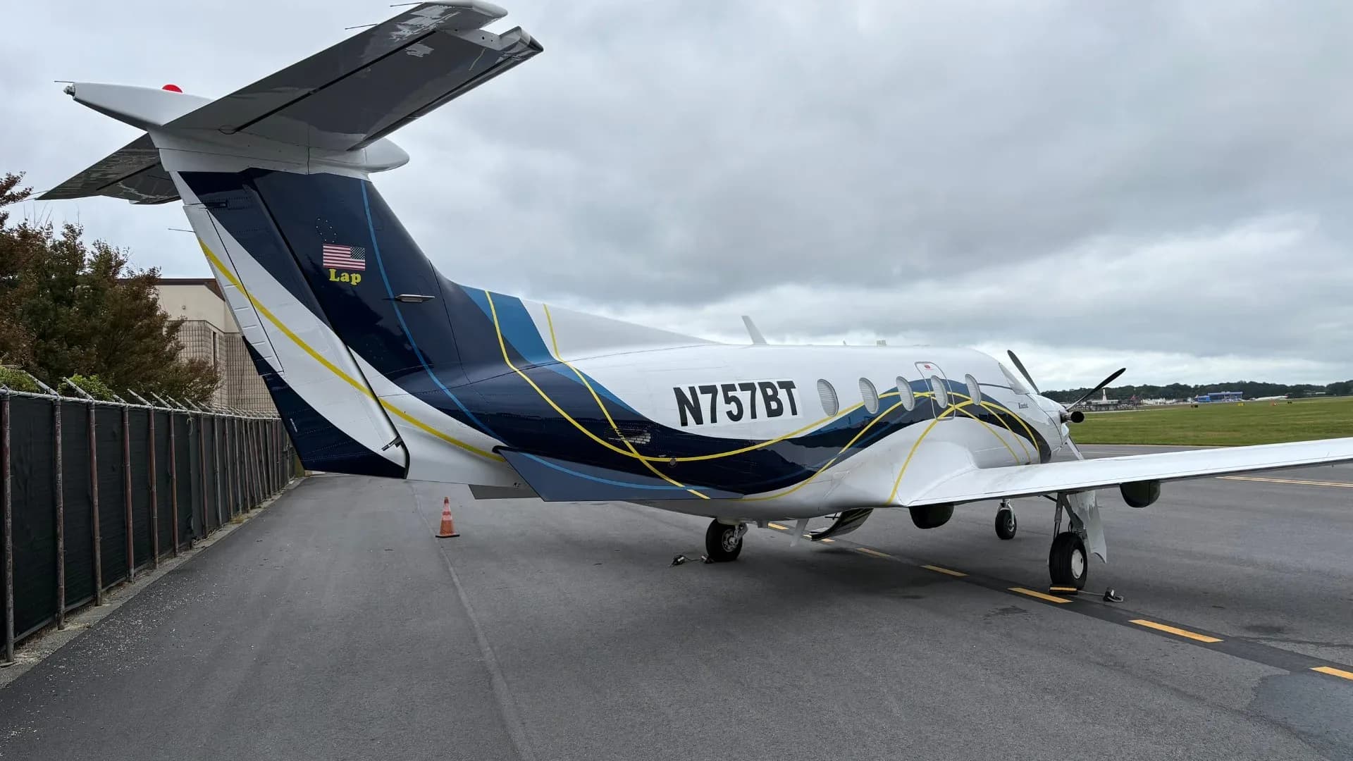 Rear view of Pilatus PC-12 aircraft N757BT on the tarmac.