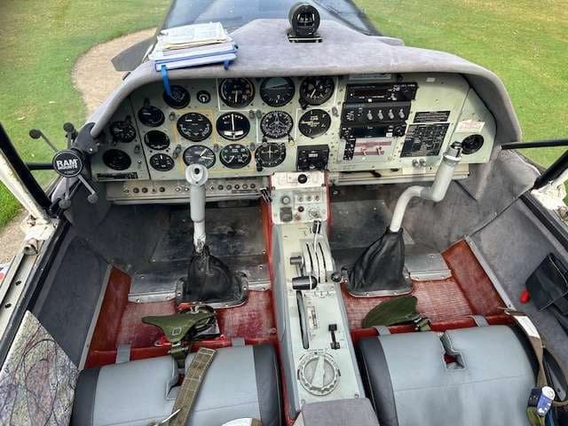 View of the cockpit of the aircraft, showing the instrument panel and controls.