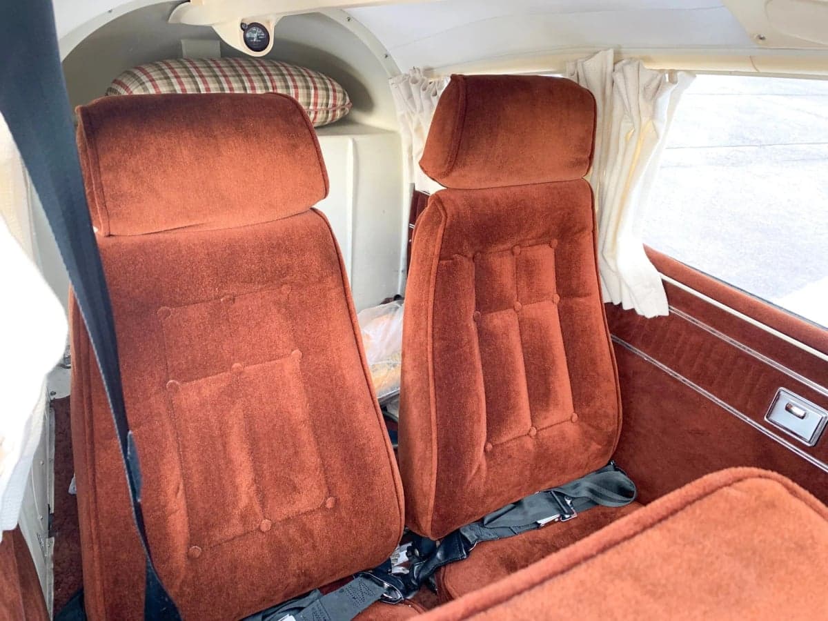 Close-up of the aircraft's brown upholstered seats.