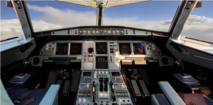 View of the aircraft cockpit instrument panel and controls.