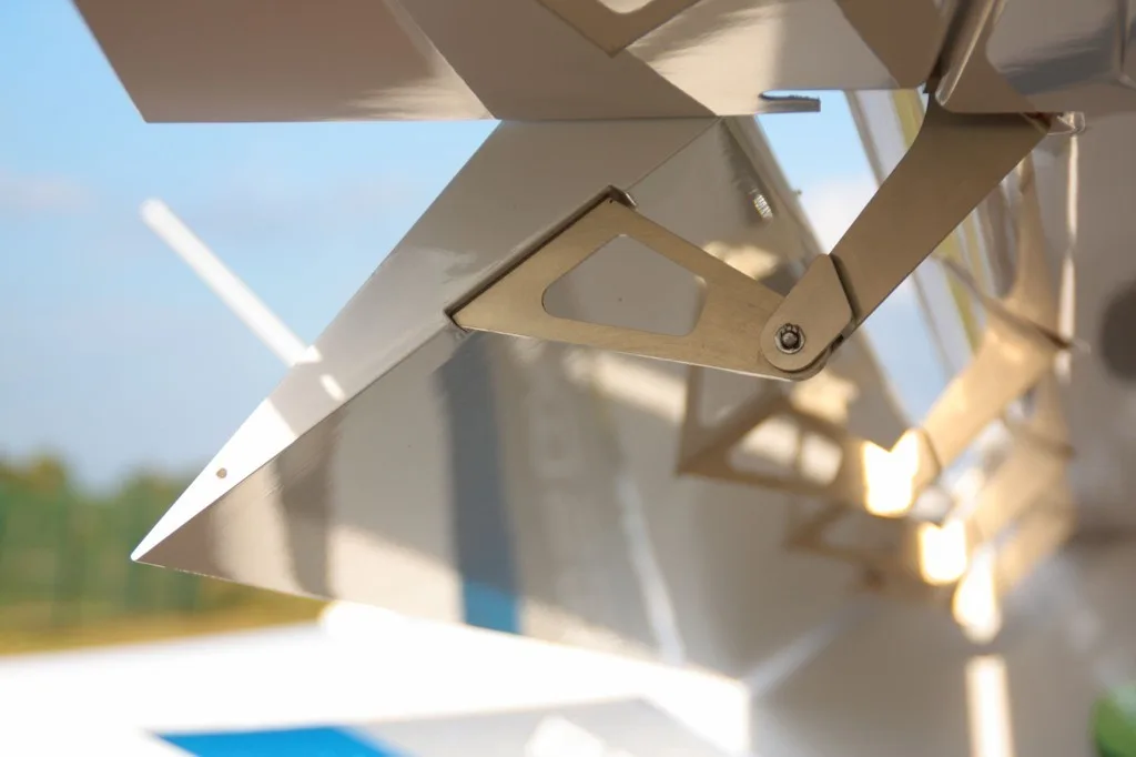 Close-up of the tail section of a REMOS GX aircraft.