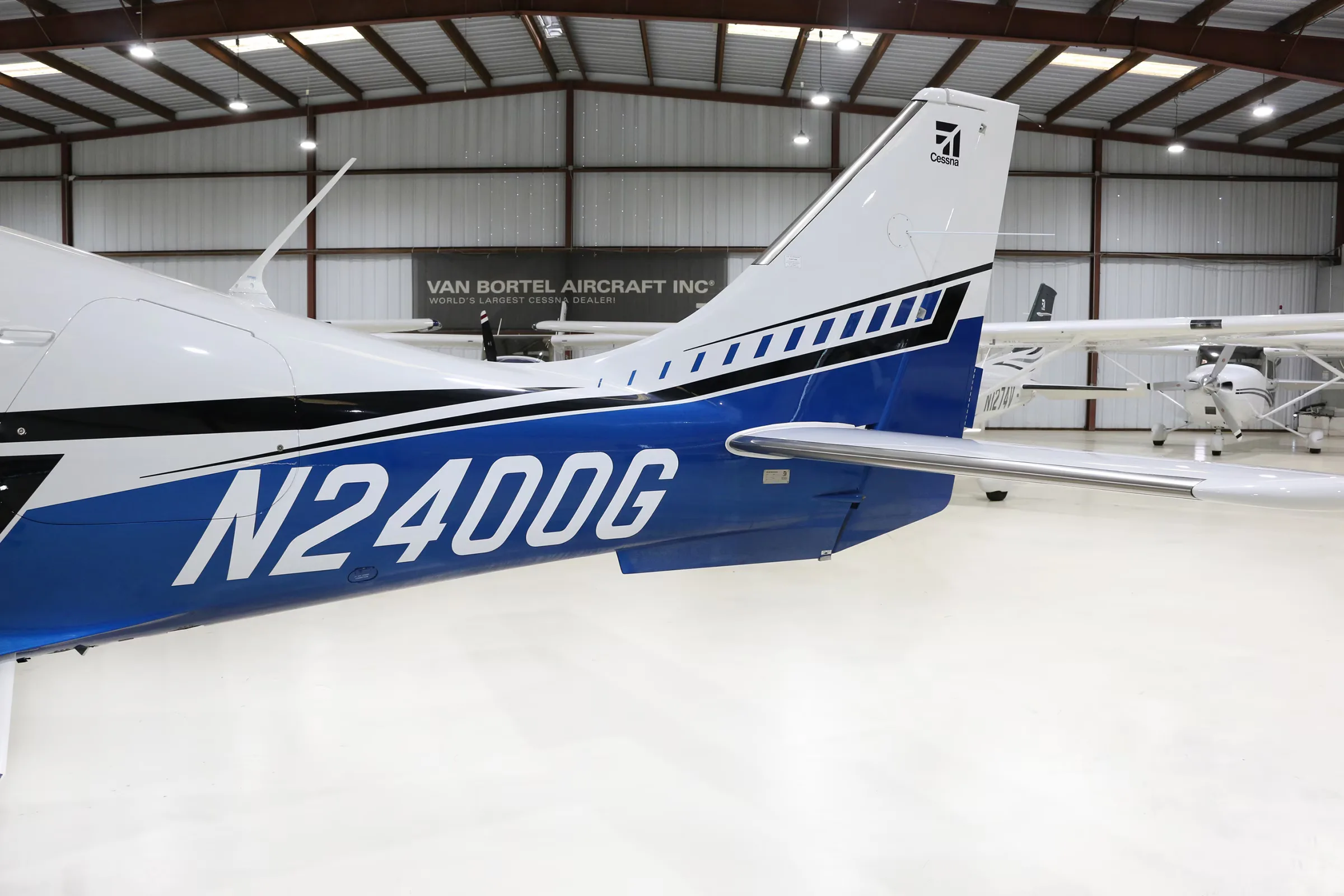 Tail section of Cessna TTX aircraft N2400G in a hangar.