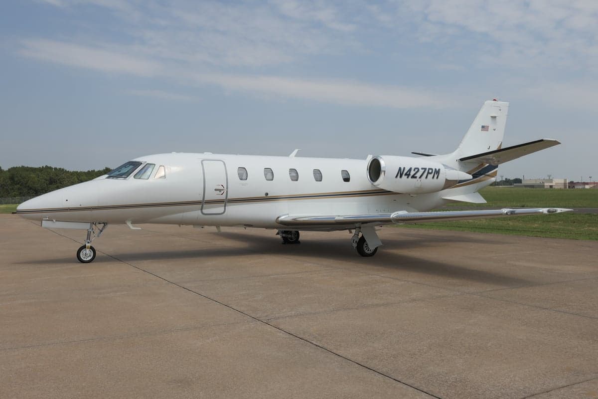 A Citation XLS+ aircraft with registration N427PM is parked on the tarmac.