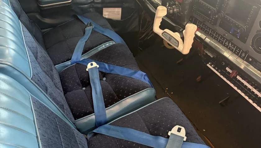 View of the aircraft cabin seats and control yoke.