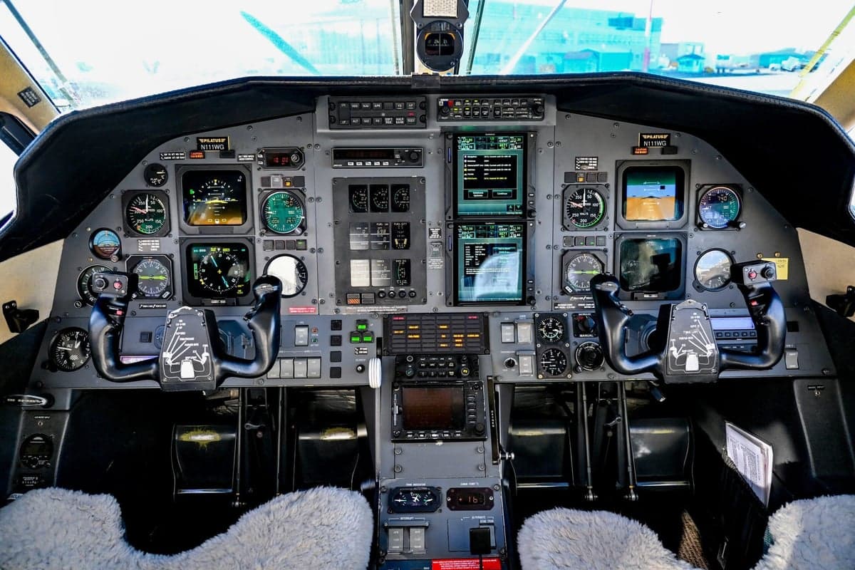 The cockpit of the Pilatus PC-12, showcasing the instrument panel and controls.