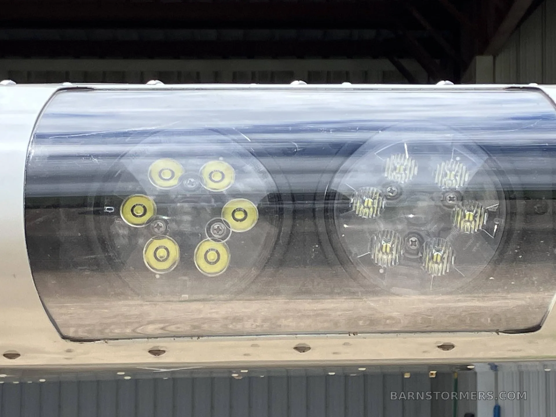 A close-up view of the LED landing or navigation lights on the wingtip of an aircraft.