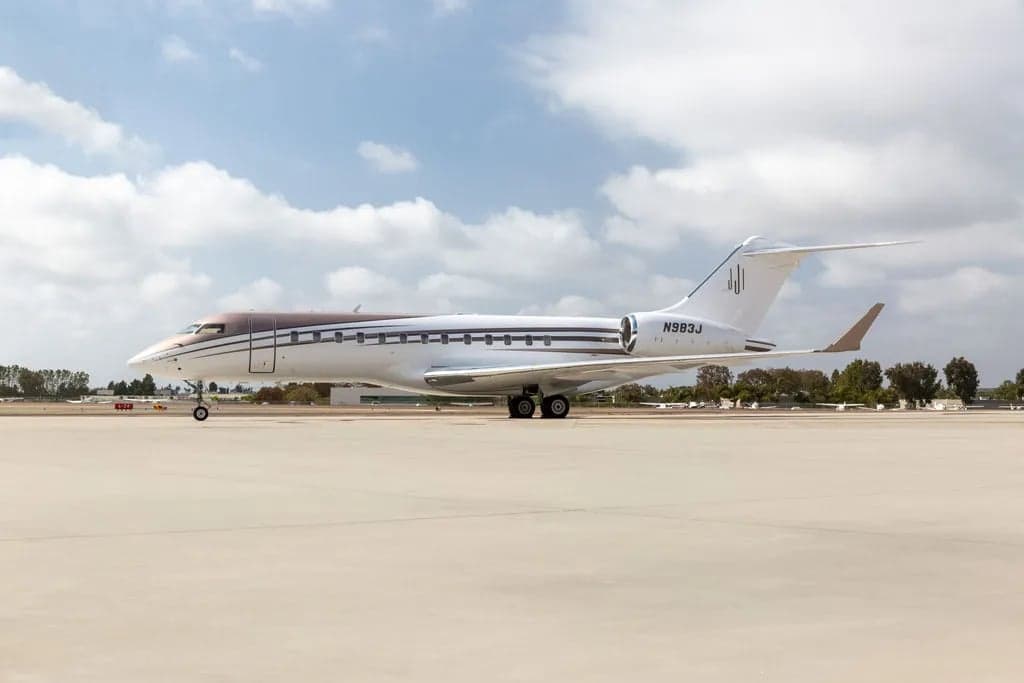 A Bombardier Global Express aircraft with registration N983J parked on the tarmac.