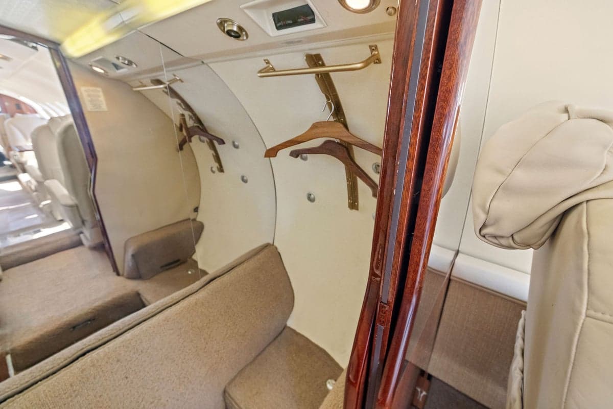 View of the aircraft interior showing a closet and seating.