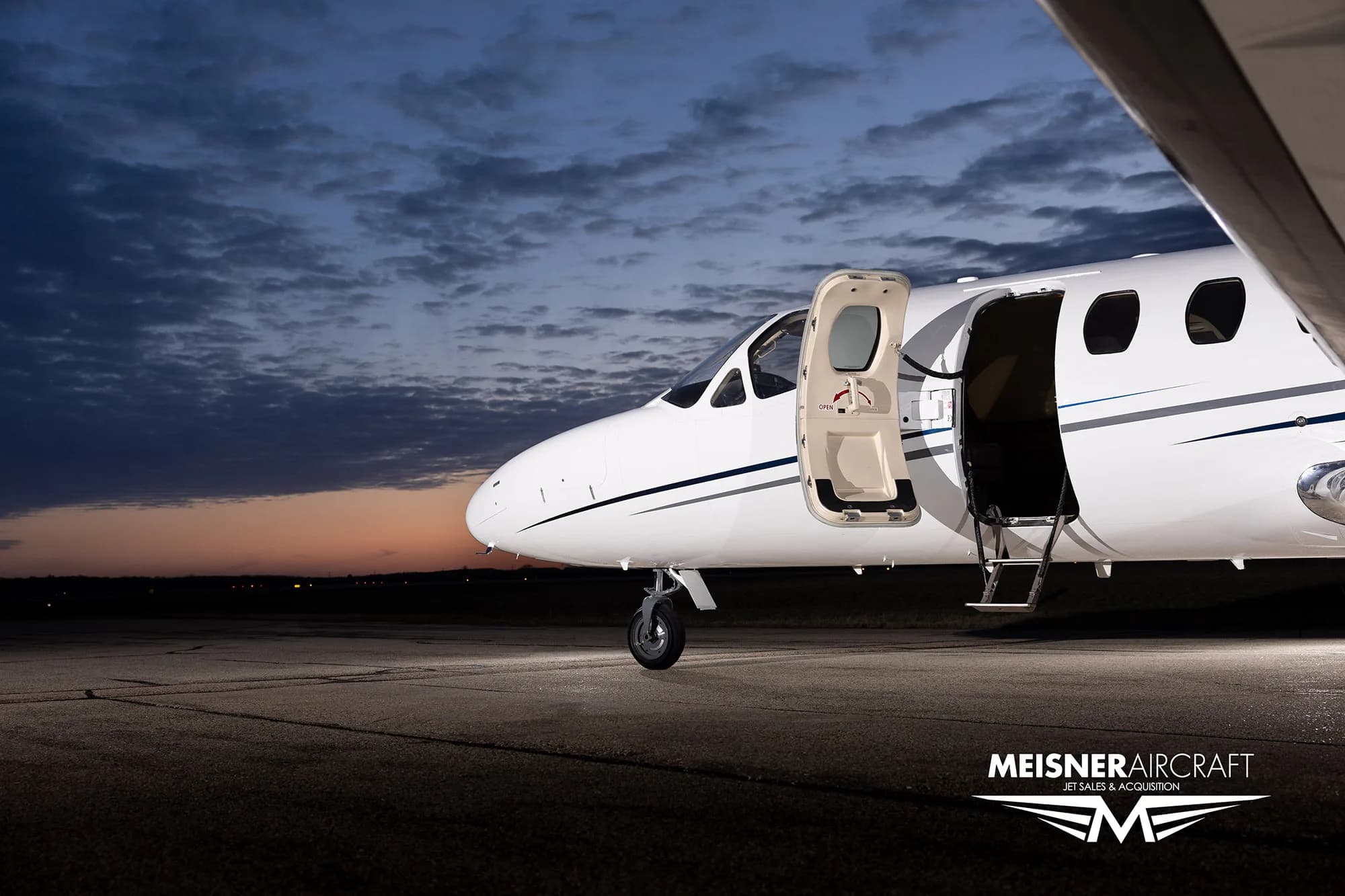 Close up of the nose and open door of N797MM Cessna Citation.