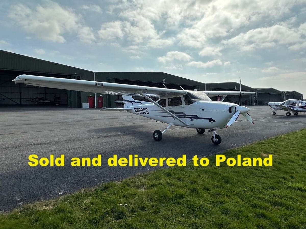A Cessna 172 Skyhawk on the tarmac with "Sold and delivered to Poland" overlaid.