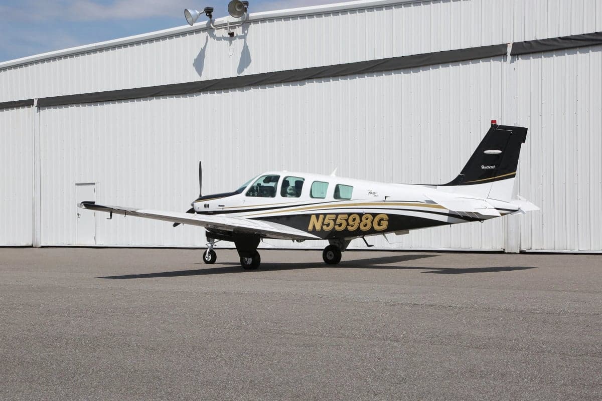 Side view of a Beechcraft Bonanza aircraft with tail number N5598G.