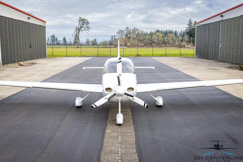 Front view of Cirrus SR22T aircraft N282CD parked on the tarmac.