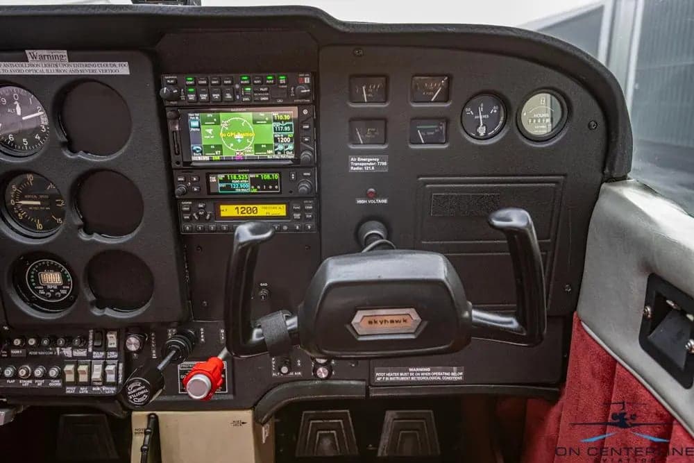 Detailed view of the Cessna 172 Skyhawk instrument panel and controls.