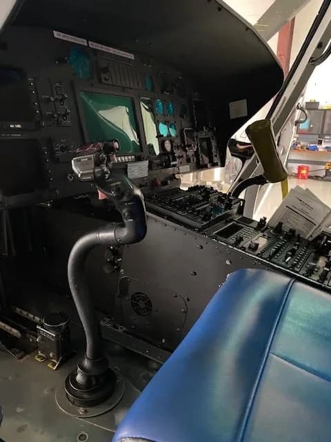 Close-up view of the helicopter's instrument panel and controls.