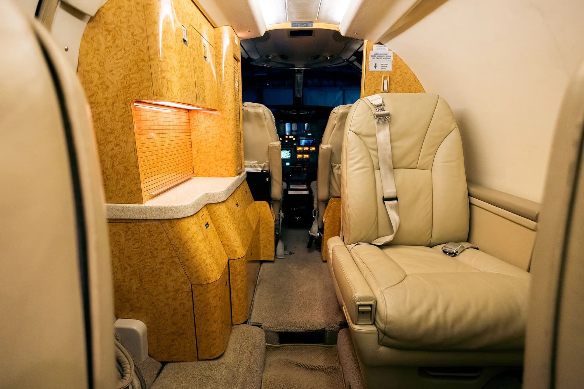 View of the Cessna Citation CJ1+ cabin seats and storage.