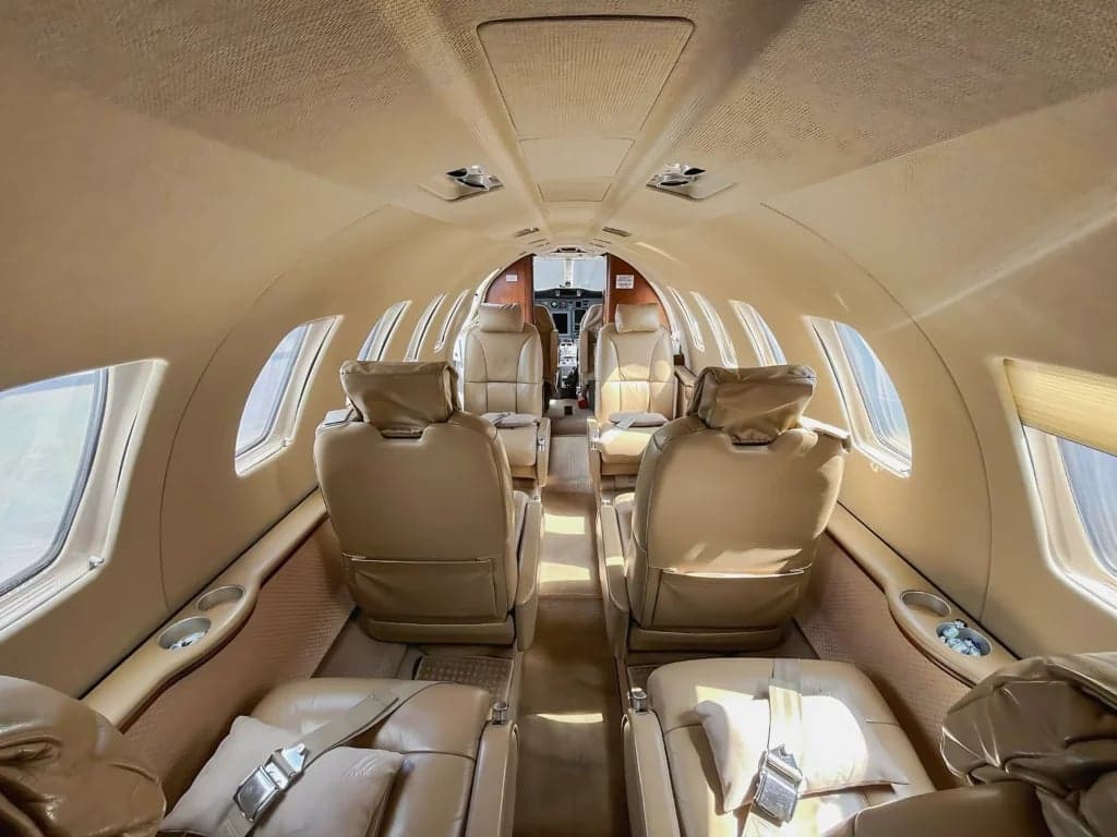 A view of the interior cabin of the aircraft, showing the seating arrangement and layout.