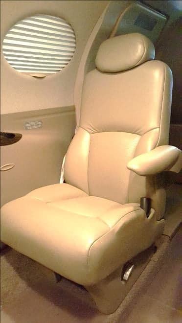 A leather seat inside the aircraft cabin.