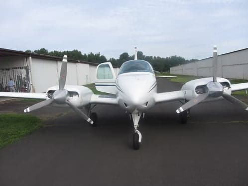 Front view of a Beechcraft Bonanza N8969M with the door open.