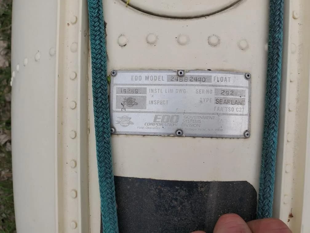 A close-up of a metal data plate for an EDO 249B 2440 seaplane float, serial number 292.