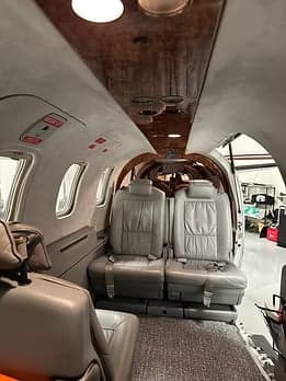 View of the aircraft's interior seating and ceiling.