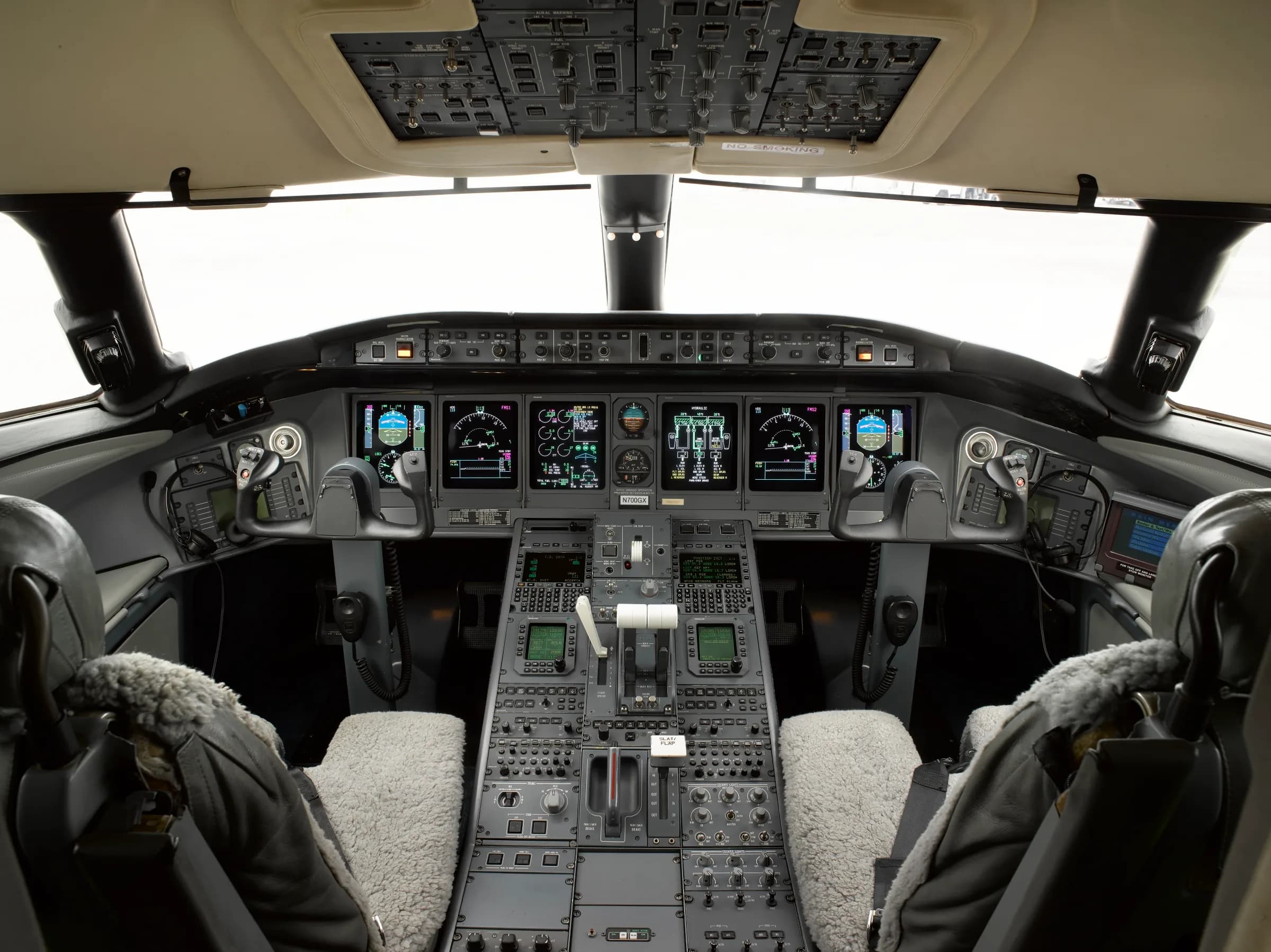 Cockpit view showing the instrument panel and pilot seats.