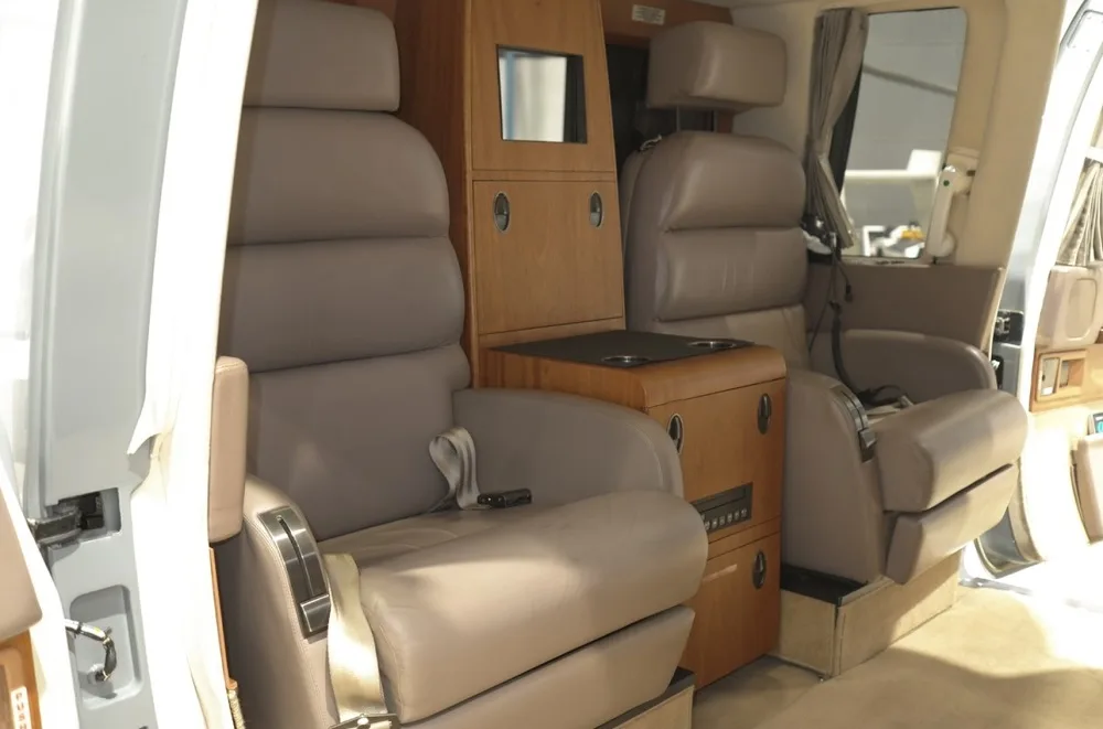 View of the helicopter's cabin seats and interior features.