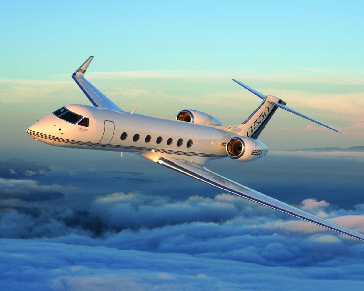A Gulfstream G550 flying above the clouds.