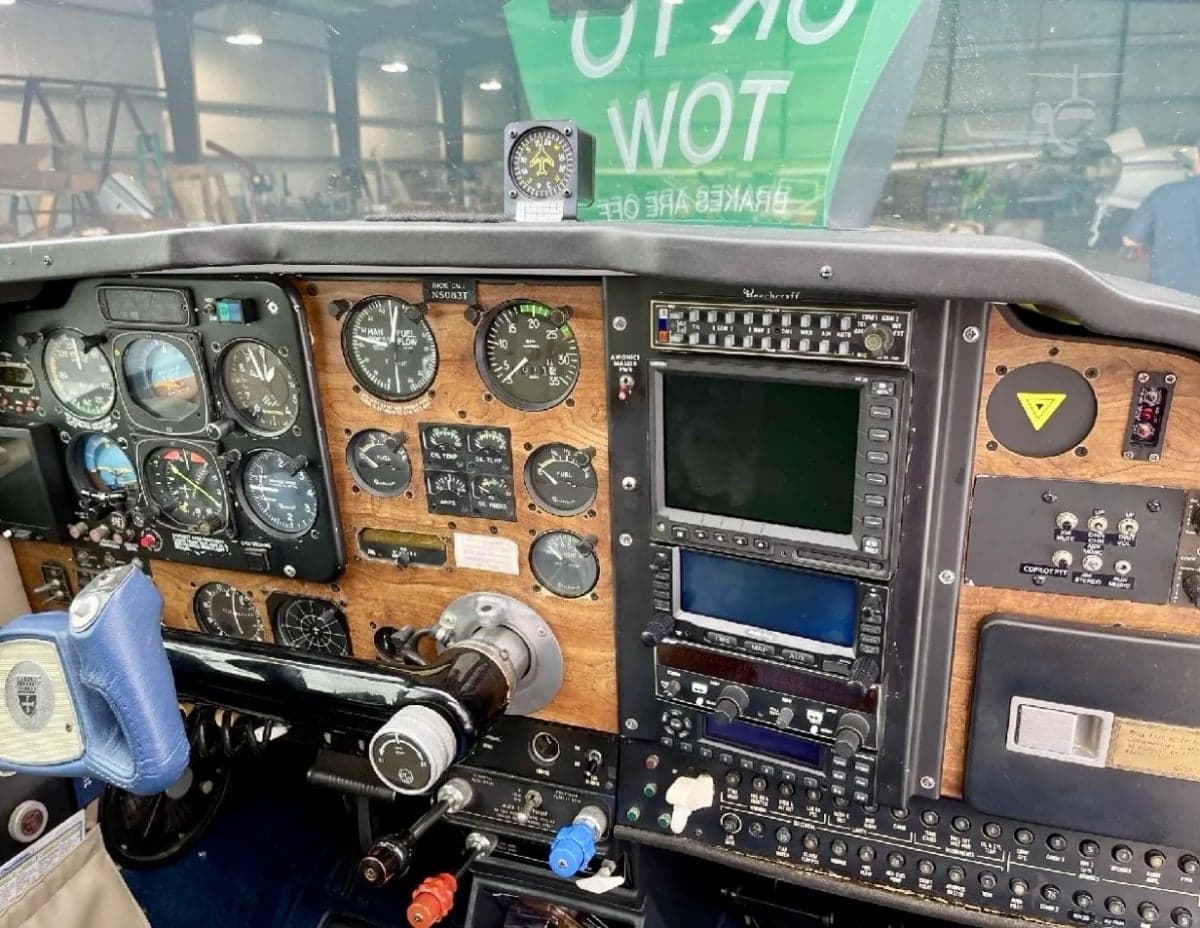 Close-up of the aircraft's instrument panel with various gauges and avionics.