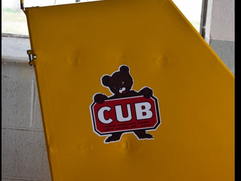 Close-up of the tail of the aircraft with a Cub logo.