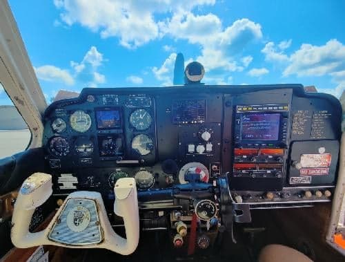 View of the aircraft's instrument panel and control yoke.