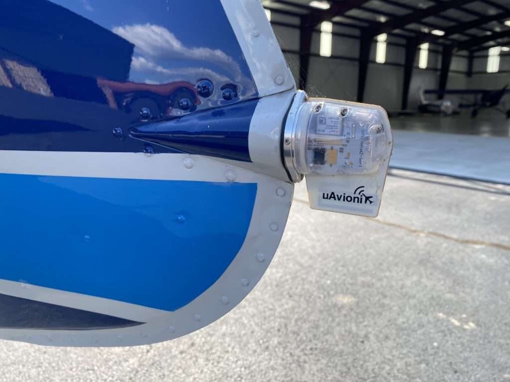Close-up of the tail light and uAvionix tailBeacon of the Mooney M20C aircraft.