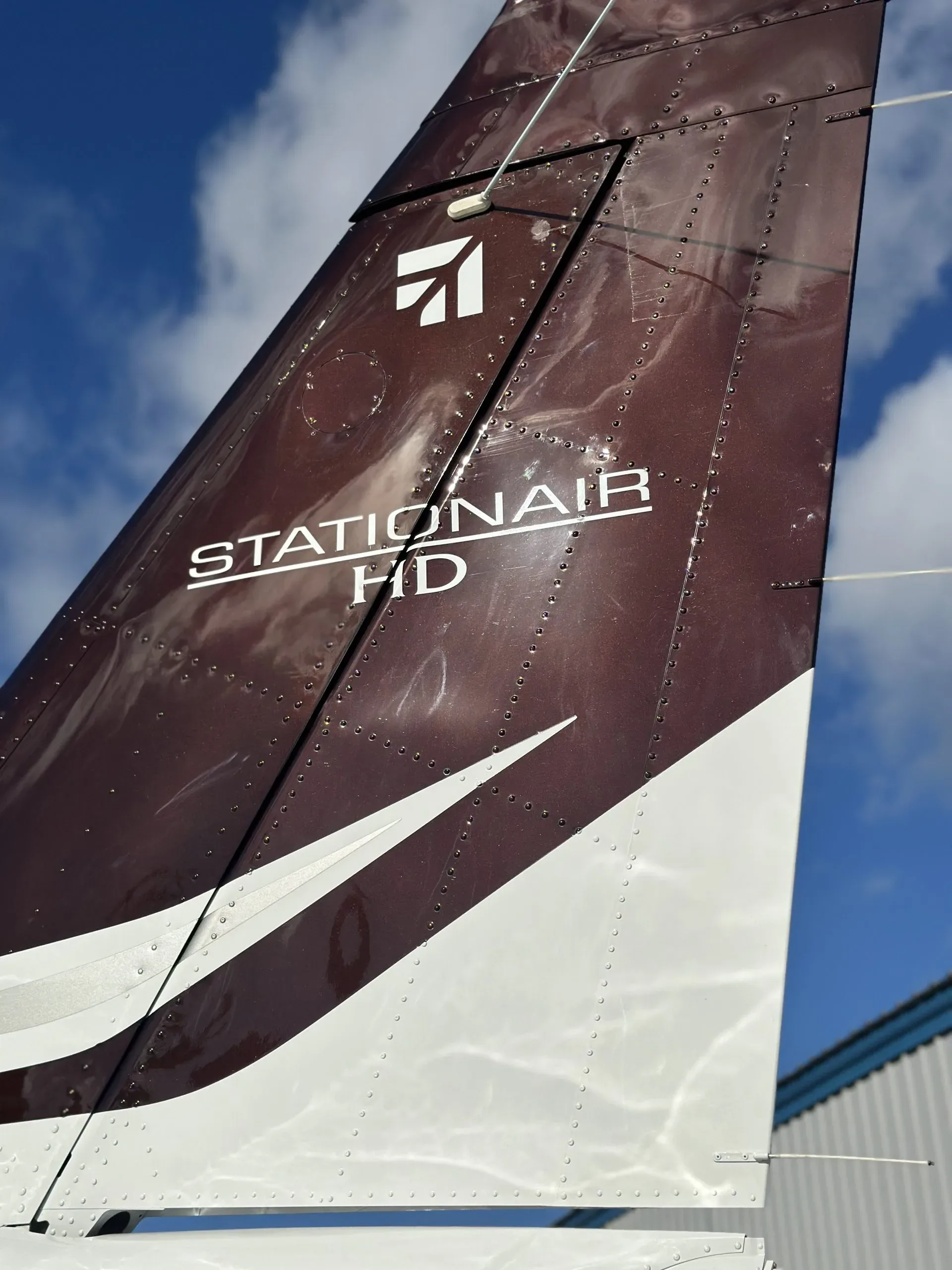 A close-up of the Cessna Stationair HD tail, showing the branding and rivet details.