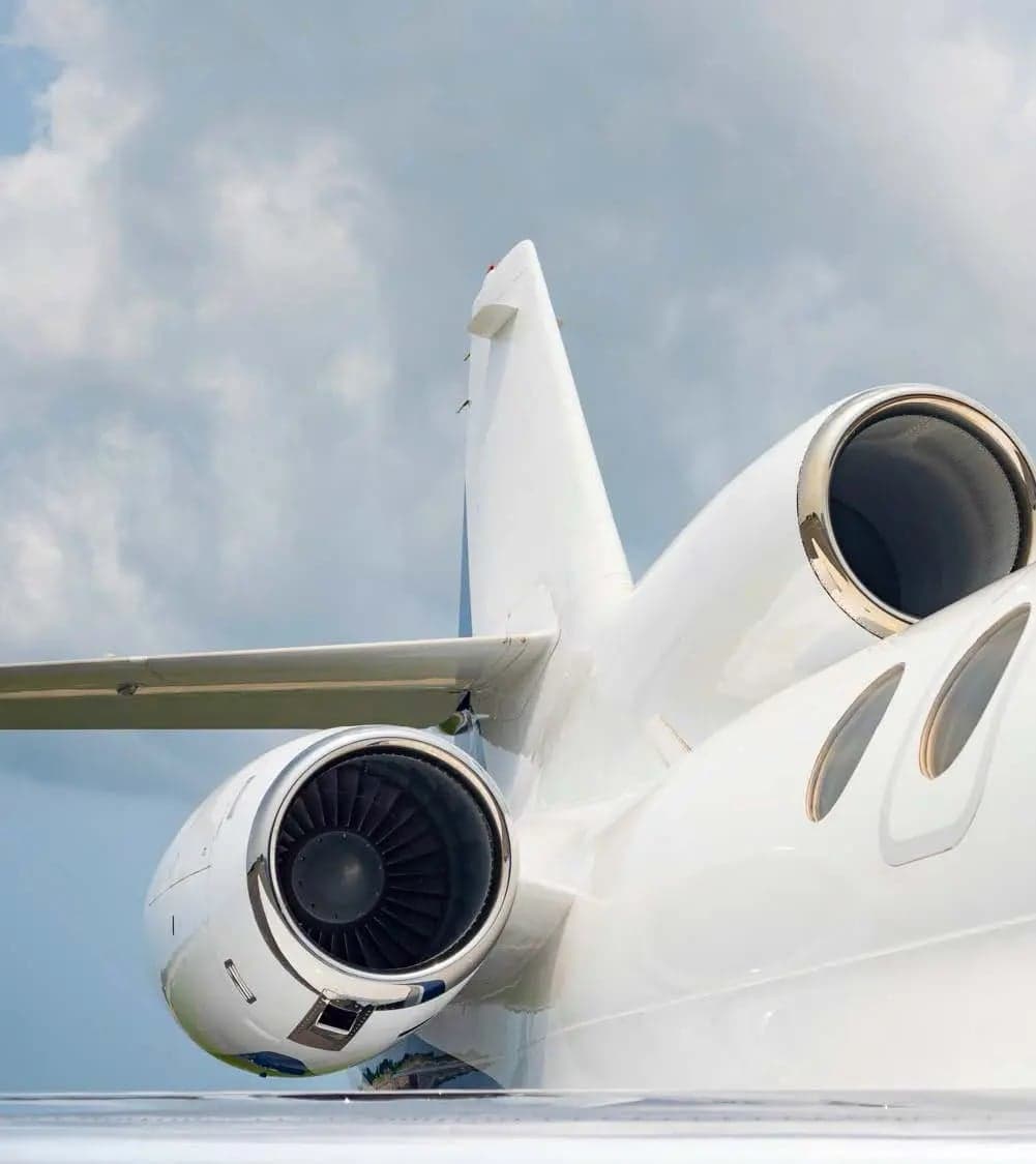 Close up of the tail and engines of a Falcon jet.
