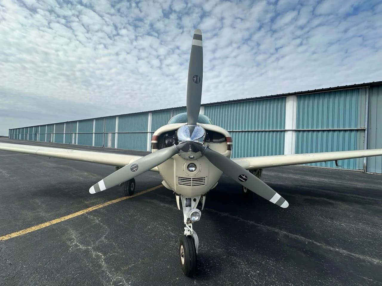 Close up front view of a Beechcraft Bonanza N1550D on the tarmac.