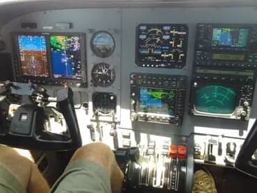 The cockpit of a Cessna 421C Golden Eagle aircraft with various instruments and controls.