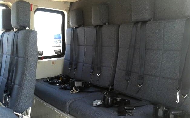View of the helicopter cockpit with instrument panel and controls.