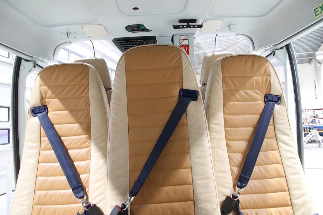 A view of the interior seats of a helicopter.