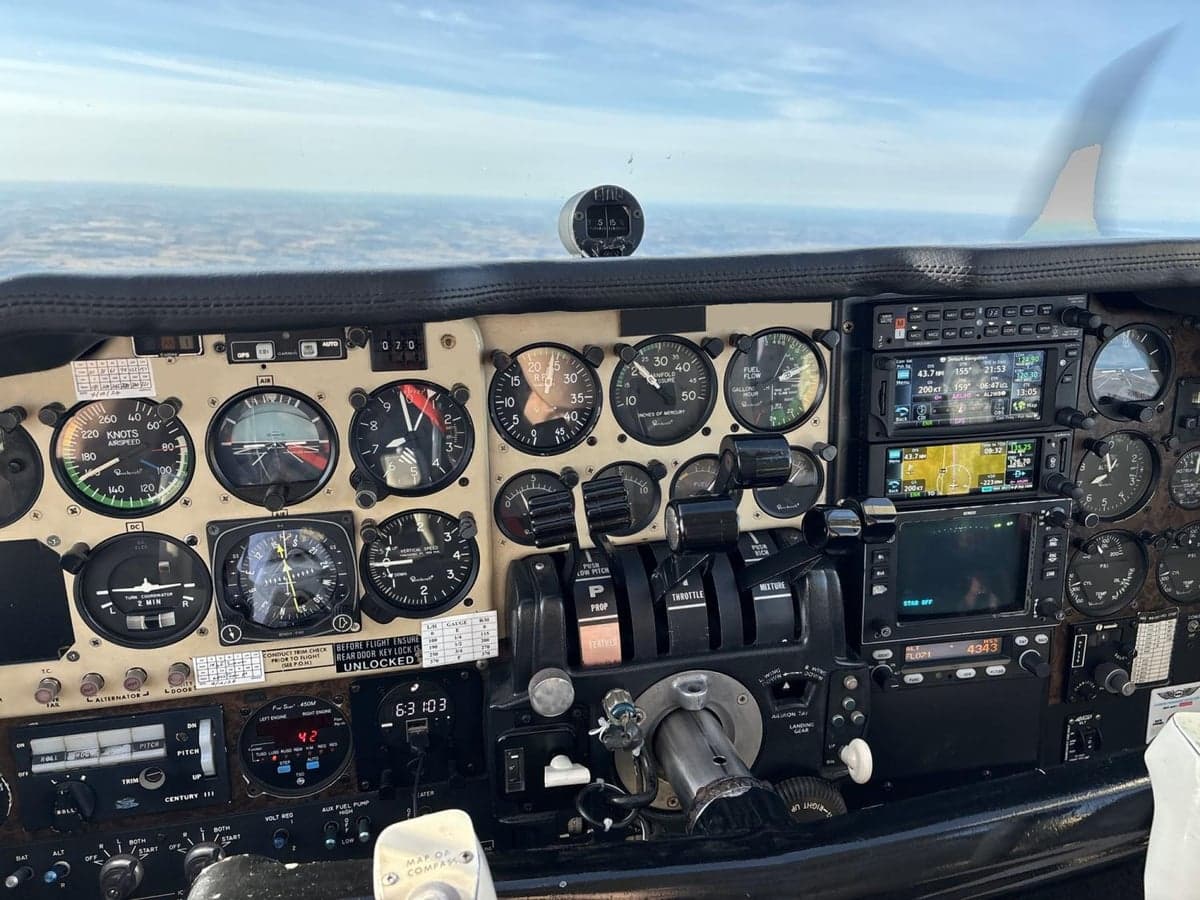 The aircraft's instrument panel shows various gauges and controls.