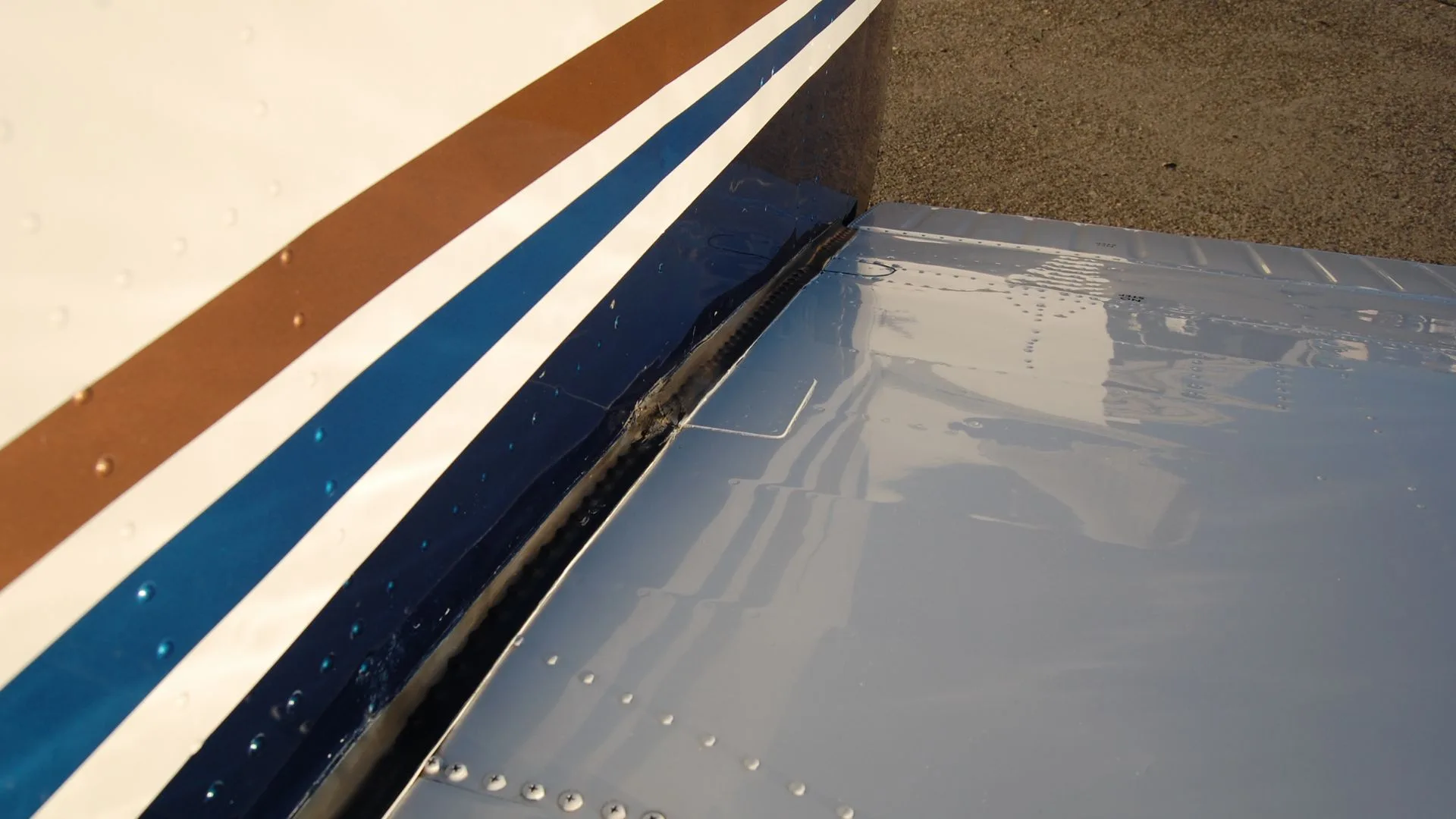 Close-up of the aircraft's wing and paint scheme.