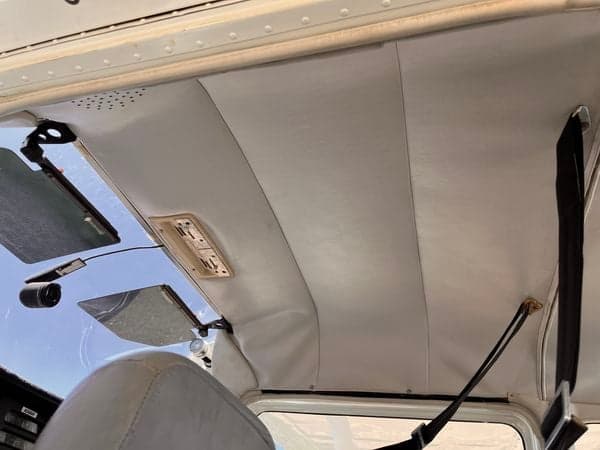 The ceiling of the aircraft N2680F, showing the headliner and sun visors.