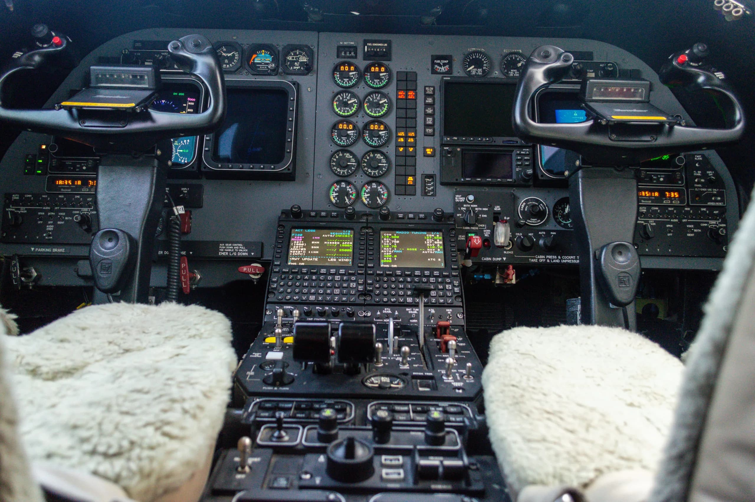 View of the Learjet cockpit with instrument panel and controls.
