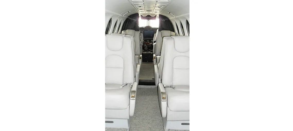King Air 350 cabin interior with white leather seats.