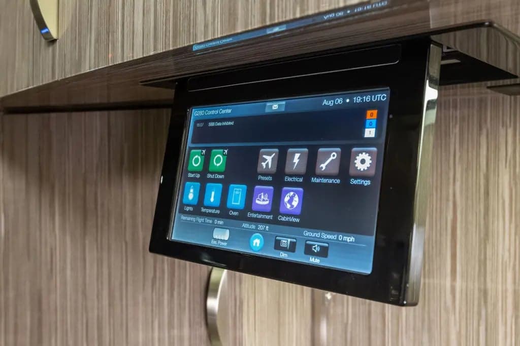 Close-up of a control panel screen in the aircraft cabin.