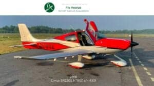 A Cirrus SR22G6 aircraft with registration N78SZ is parked on the tarmac with its doors open.