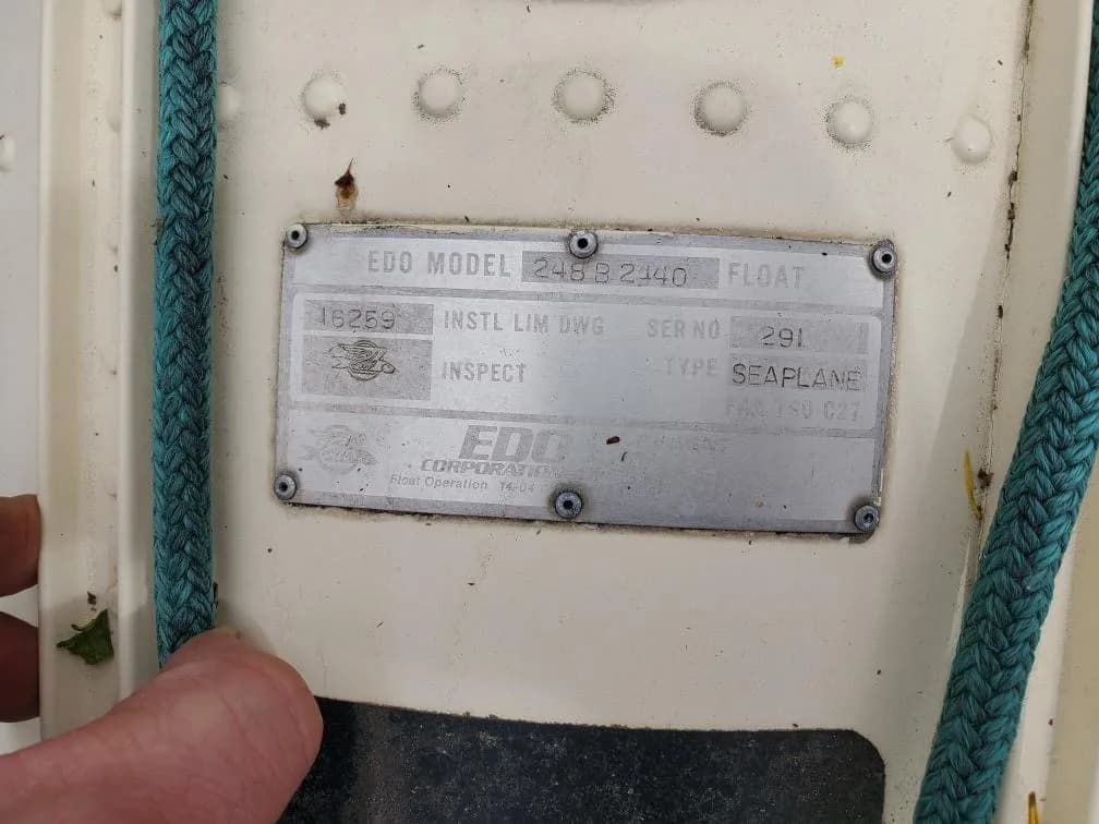 A close-up of a metal data plate for an EDO 249B 2440 seaplane float.