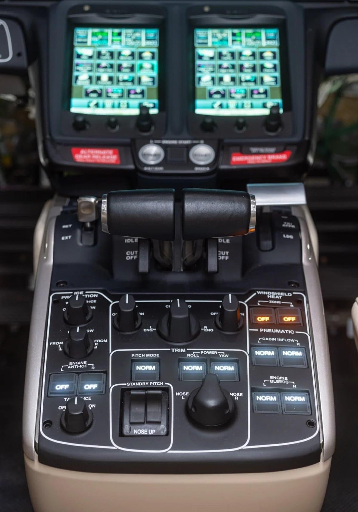 Close-up of the throttle controls and switches in the HondaJet cockpit.