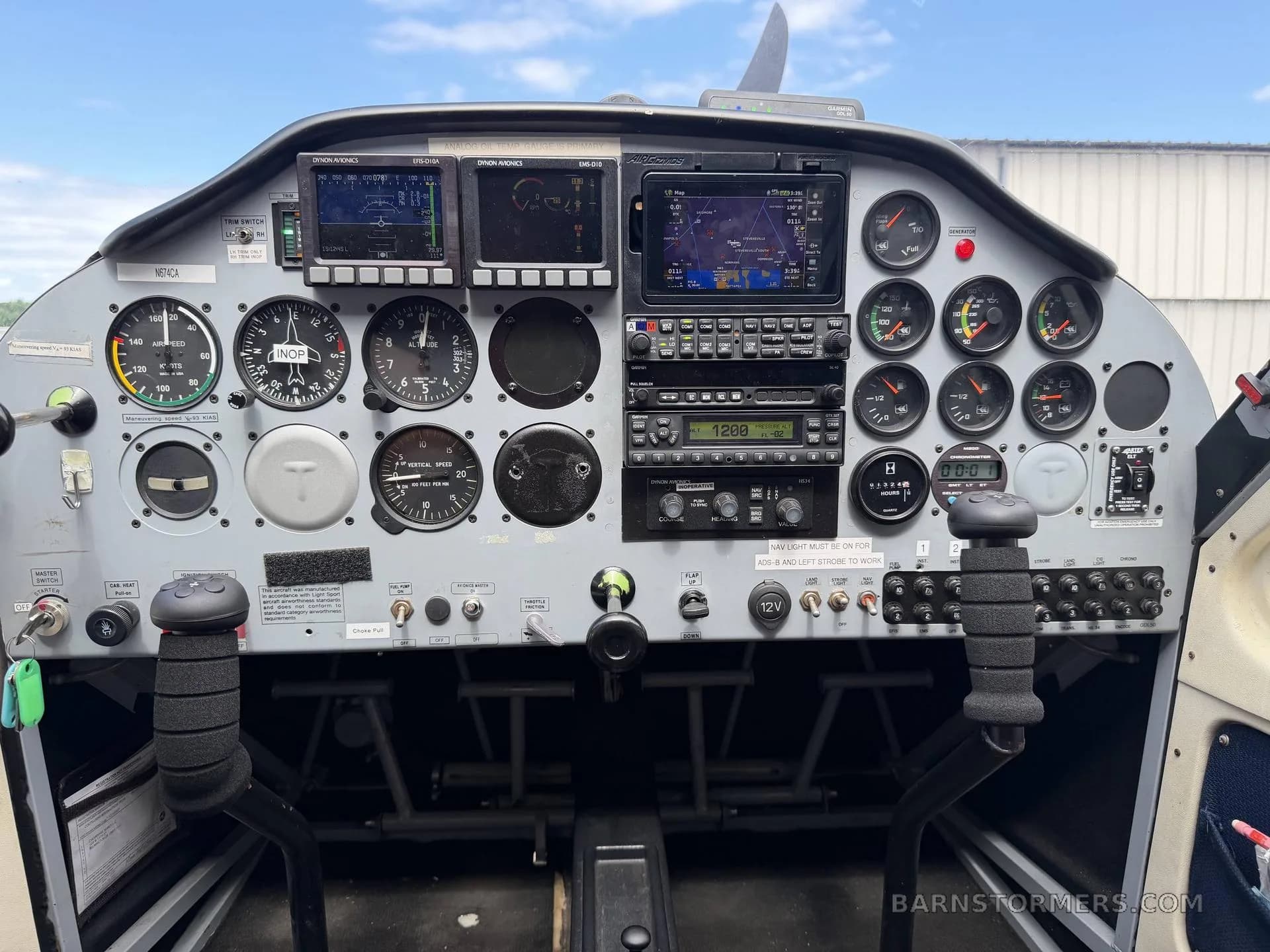 The instrument panel of a light sport aircraft, featuring both analog gauges and digital displays.