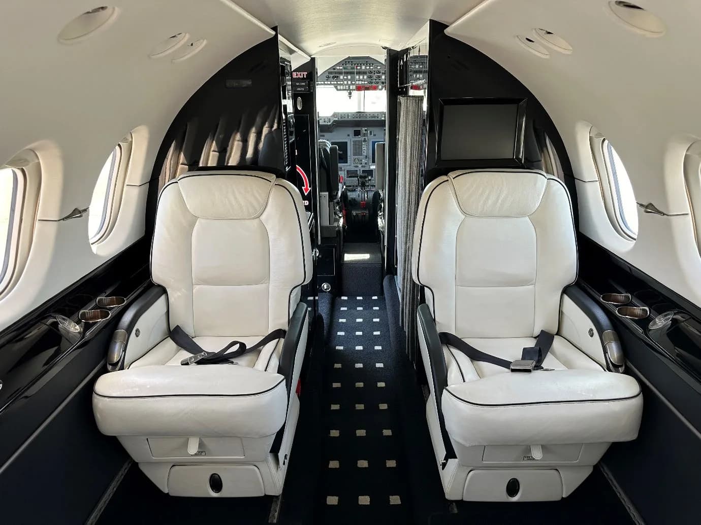 Interior view of the Hawker 400XP cabin looking towards the cockpit.