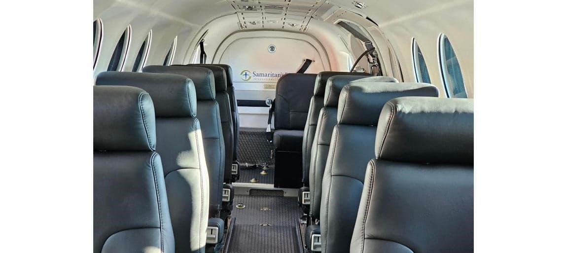 King Air 200 cabin interior with black leather seats.